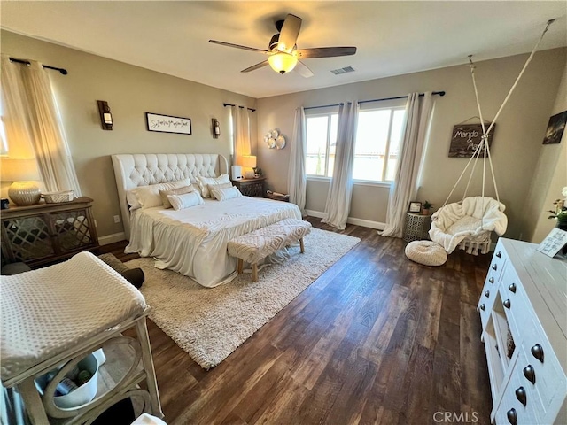 bedroom featuring ceiling fan and dark wood-type flooring