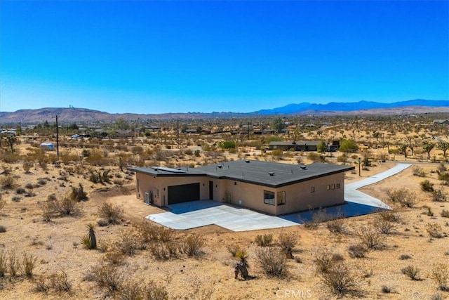 birds eye view of property with a mountain view