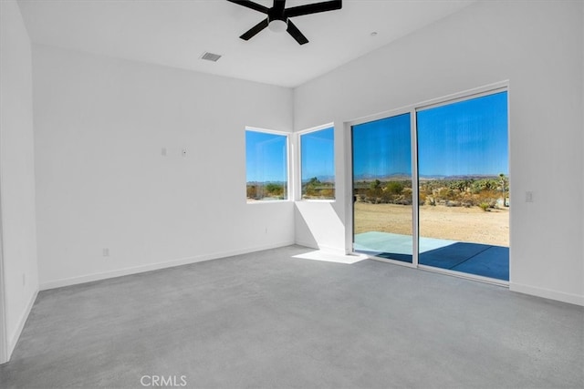 spare room with carpet and ceiling fan