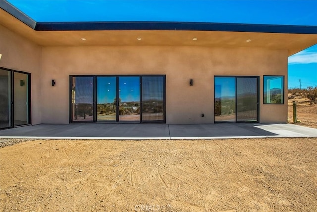 rear view of house featuring a patio