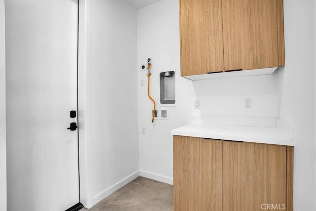 washroom featuring cabinets and hookup for a washing machine