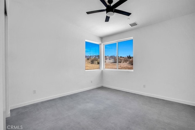 carpeted empty room featuring ceiling fan