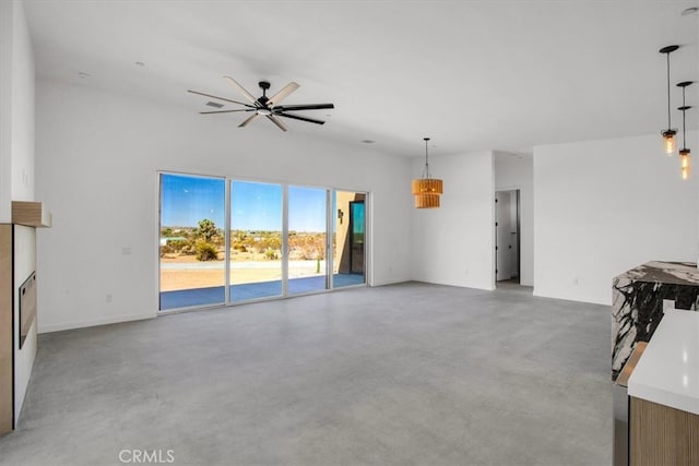 unfurnished living room with ceiling fan