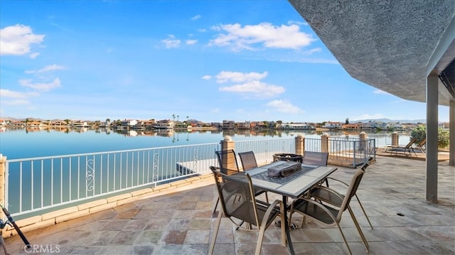 view of patio with a water view