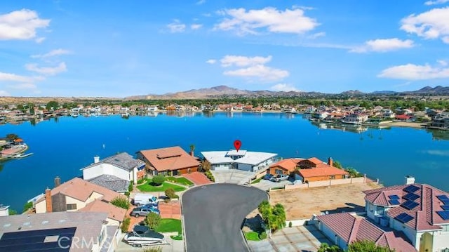 bird's eye view with a water and mountain view