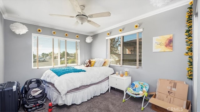 carpeted bedroom with ornamental molding and ceiling fan