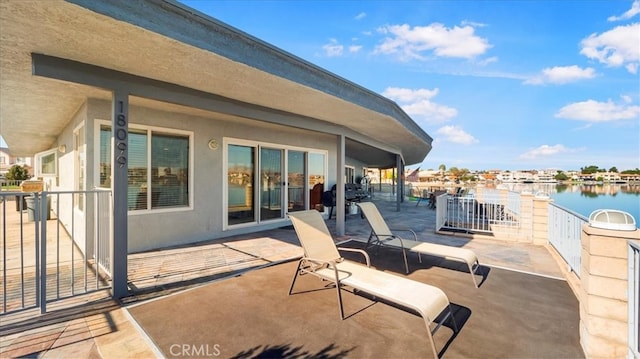 view of patio / terrace featuring a water view