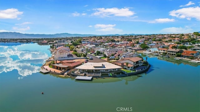 bird's eye view with a water and mountain view