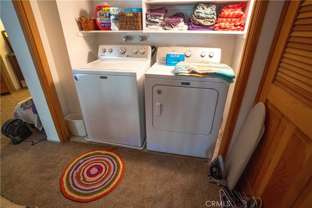 laundry area featuring separate washer and dryer and carpet