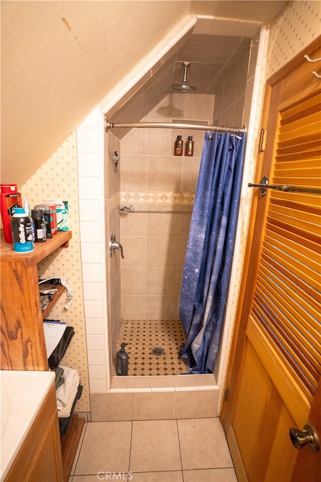 bathroom with tile patterned flooring, a shower with shower curtain, and vanity