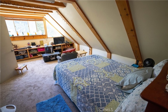 bedroom featuring lofted ceiling with beams and carpet floors