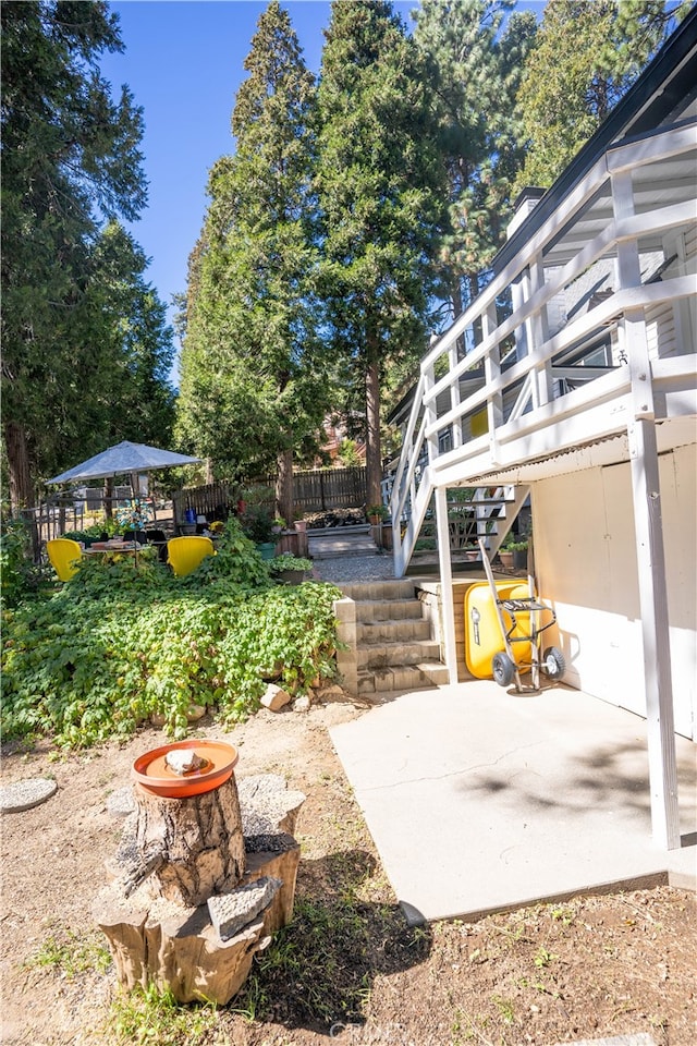 view of yard with a patio and an outdoor fire pit