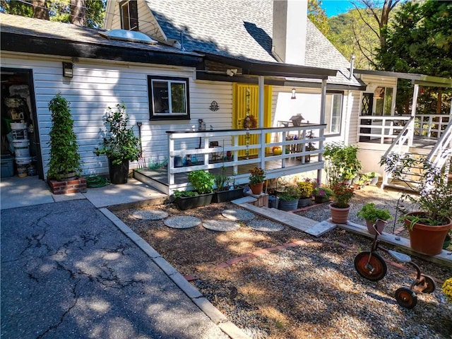 507 Valley Dr, Crestline, CA 92325 - doorway to property featuring a chimney and a shingled roof