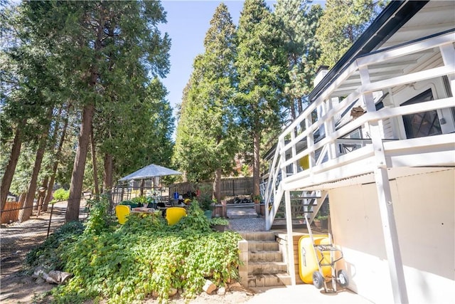 507 Valley Dr, Crestline, CA 92325 - view of yard featuring stairway, a deck, and fence