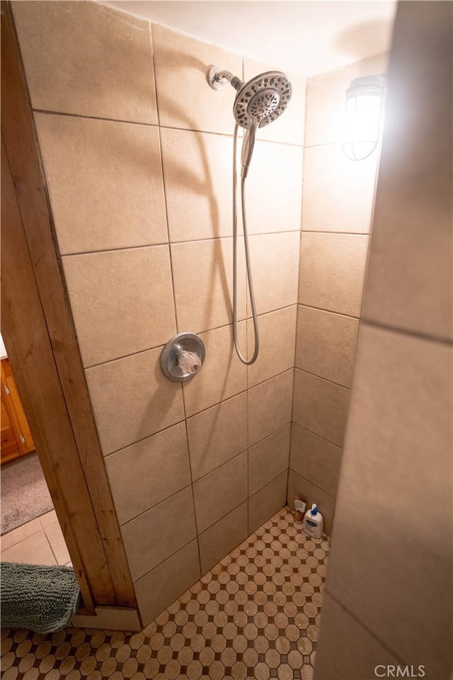 bathroom with tiled shower