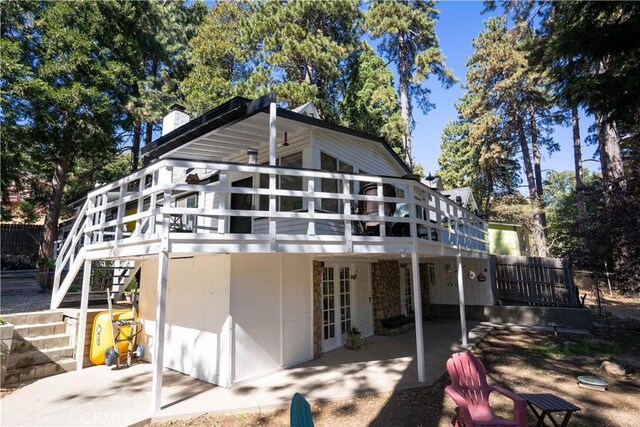 507 Valley Dr, Crestline, CA 92325 - back of house featuring a patio, fence, a deck, and stairway