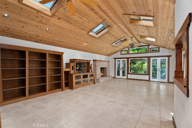 unfurnished living room with ceiling fan, french doors, high vaulted ceiling, and wooden ceiling