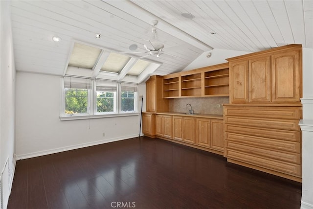 interior space with lofted ceiling with beams, ceiling fan, dark hardwood / wood-style flooring, and wood ceiling