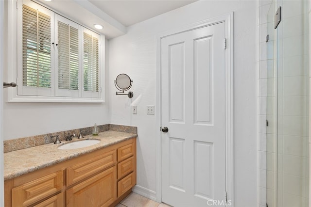 bathroom with vanity, tile patterned floors, and walk in shower