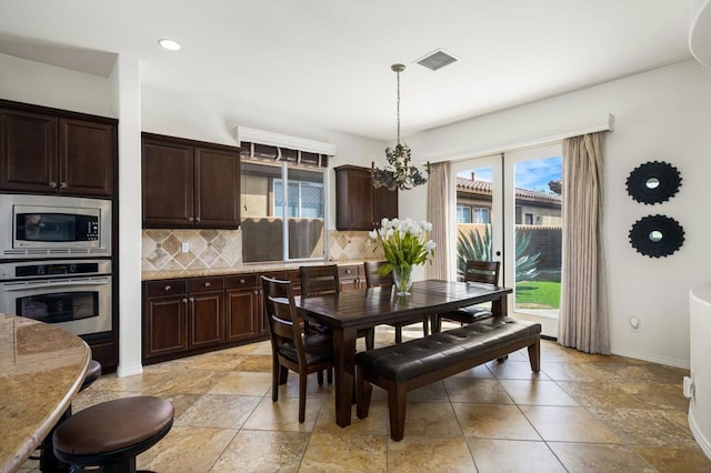 dining area featuring french doors and a healthy amount of sunlight