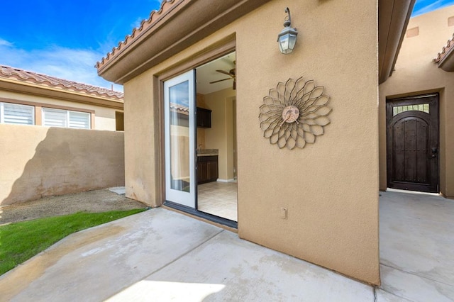 entrance to property with a patio