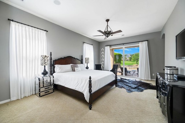 carpeted bedroom featuring access to exterior and ceiling fan