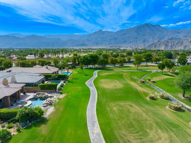 exterior space with a mountain view, a swimming pool, and a patio