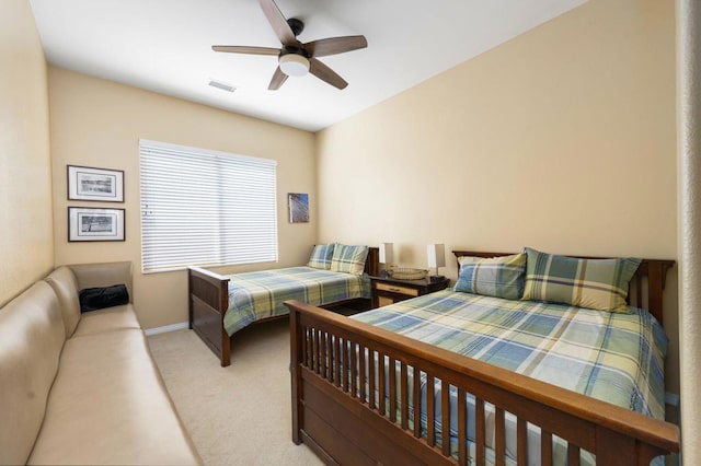 bedroom with ceiling fan and light colored carpet