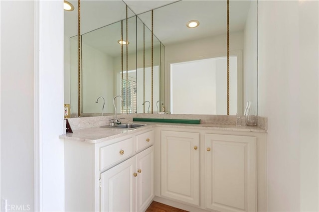 bathroom with vanity and recessed lighting