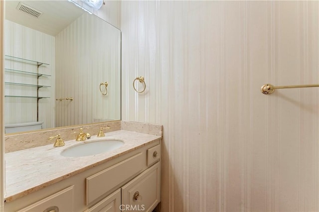 bathroom with visible vents and vanity