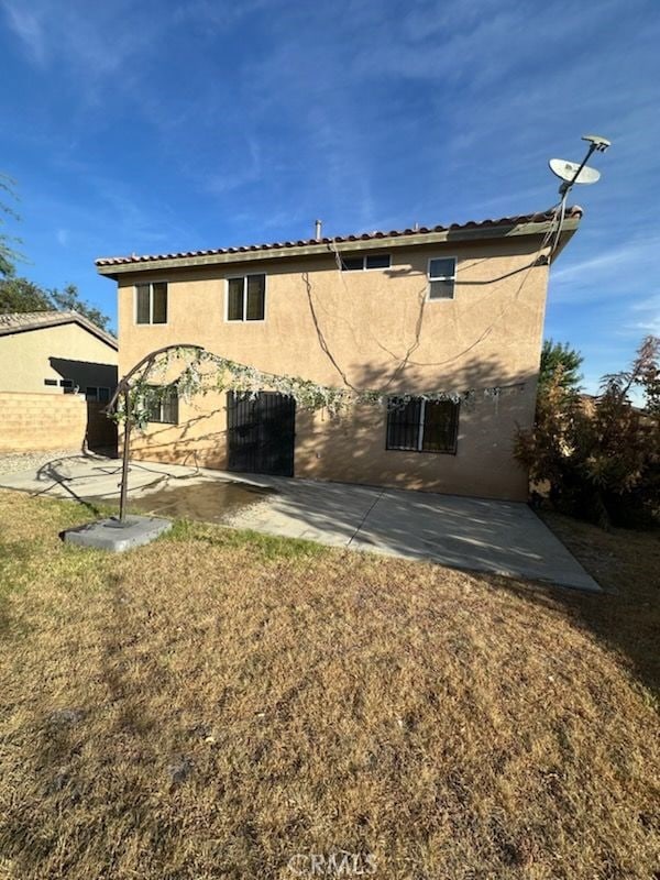 rear view of property with a patio area