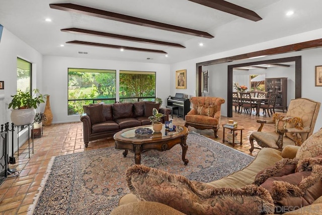 living room with beamed ceiling