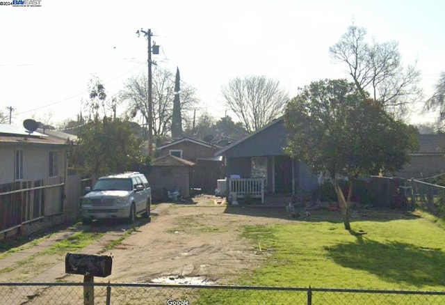 view of yard featuring covered porch