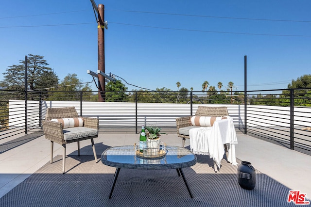 view of patio / terrace with an outdoor hangout area and a balcony