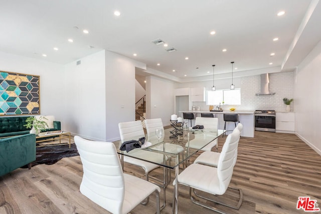 dining area with light hardwood / wood-style flooring