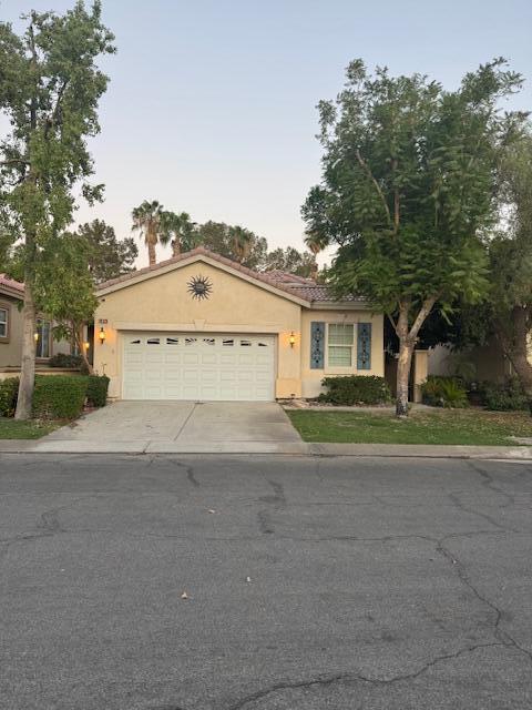 single story home with a garage