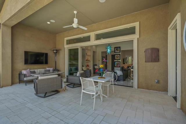 view of patio featuring outdoor lounge area and ceiling fan