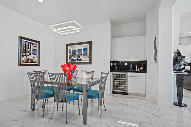 dining area featuring wet bar and beverage cooler