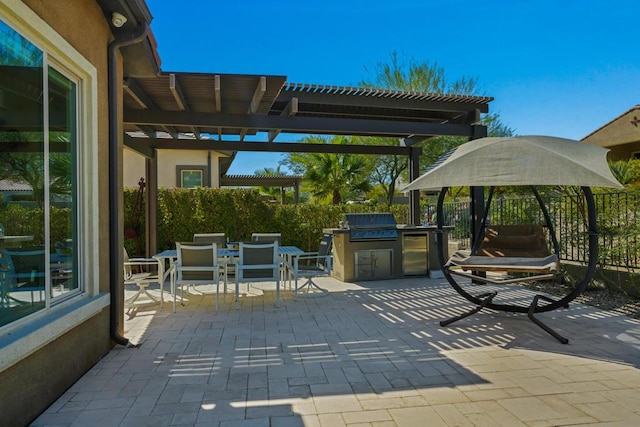 view of patio / terrace featuring area for grilling, a pergola, and grilling area