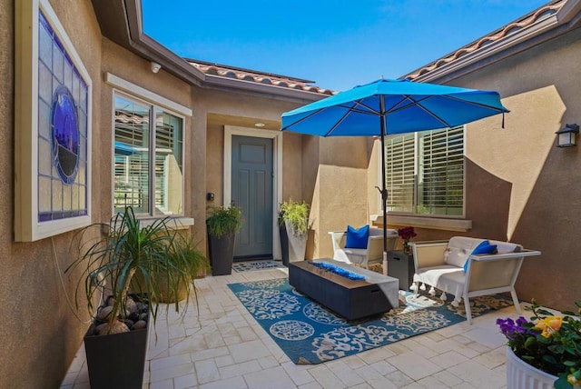 view of patio / terrace with an outdoor fire pit