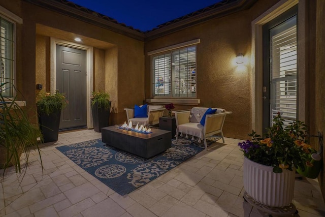 view of patio / terrace with an outdoor fire pit