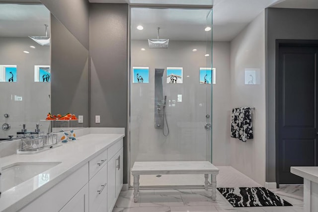 bathroom featuring vanity and tiled shower