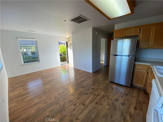 605 N Ferrocarril, Atascadero, CA 93422 - kitchen featuring freestanding refrigerator, open floor plan, dark wood finished floors, and baseboards