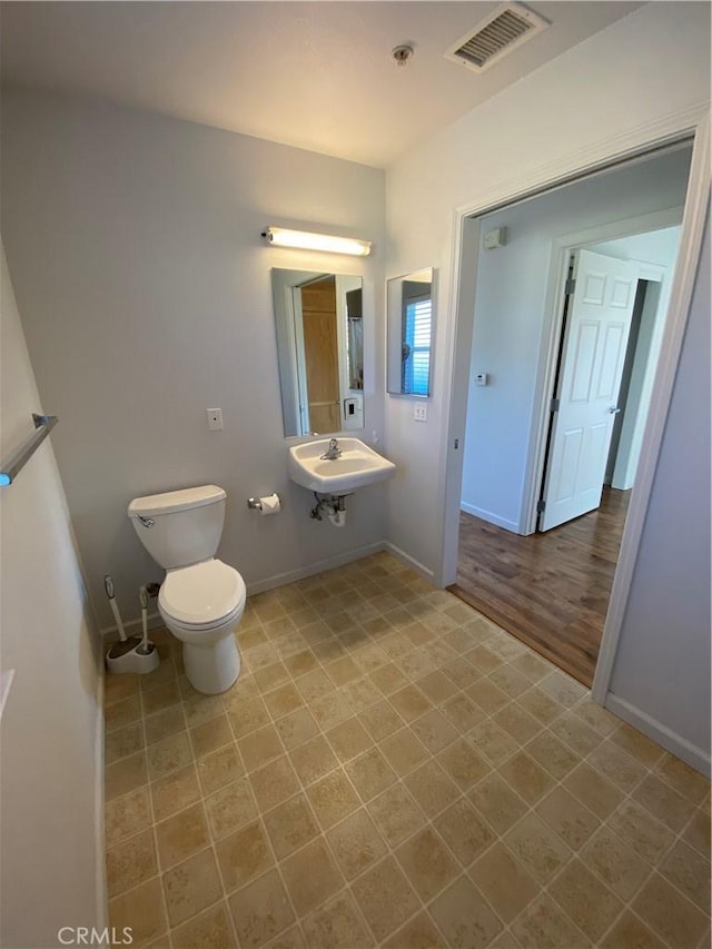 bathroom with toilet and sink