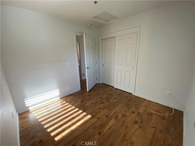 605 N Ferrocarril, Atascadero, CA 93422 - unfurnished bedroom featuring wood finished floors, a closet, baseboards, and attic access