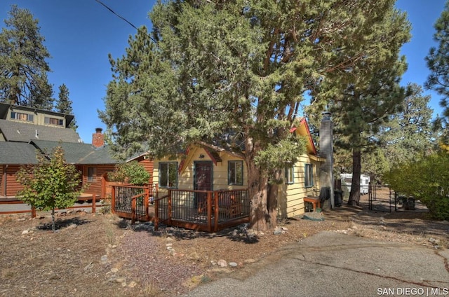 obstructed view of property featuring a wooden deck