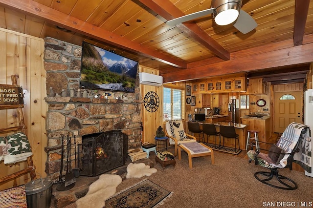 living room with a stone fireplace, wood ceiling, a wall mounted air conditioner, wooden walls, and beam ceiling