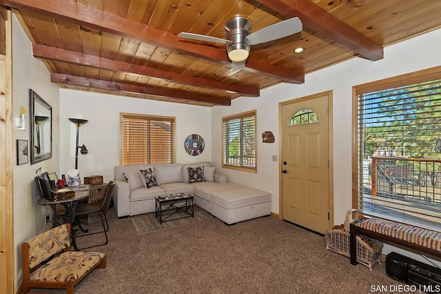 living room with dark colored carpet, ceiling fan, beam ceiling, and wooden ceiling