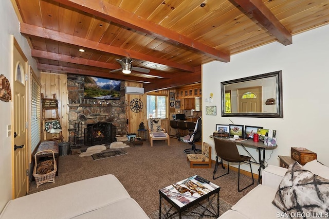 living room with wood ceiling, carpet flooring, a fireplace, an AC wall unit, and beamed ceiling