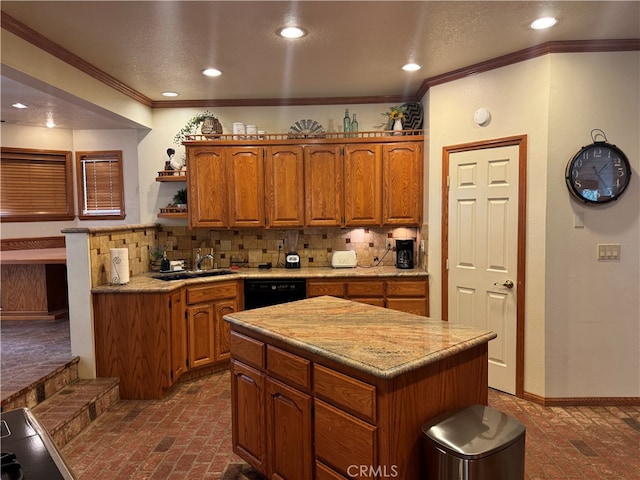 kitchen featuring decorative backsplash, black dishwasher, a kitchen island, and sink